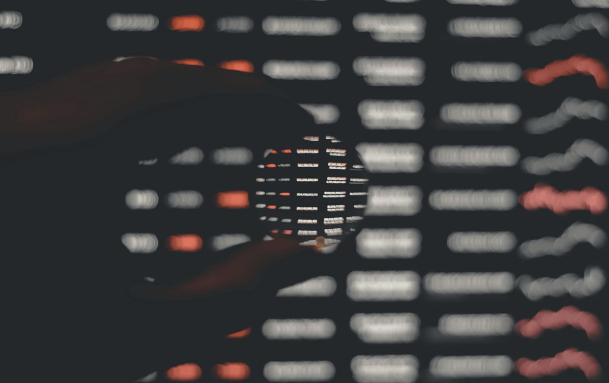 person holding black and white round ornament