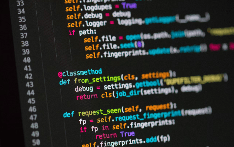 Close-up of a code editor displaying a Python class with methods and conditional logic, including a class method named from_settings and a function named request_seen.