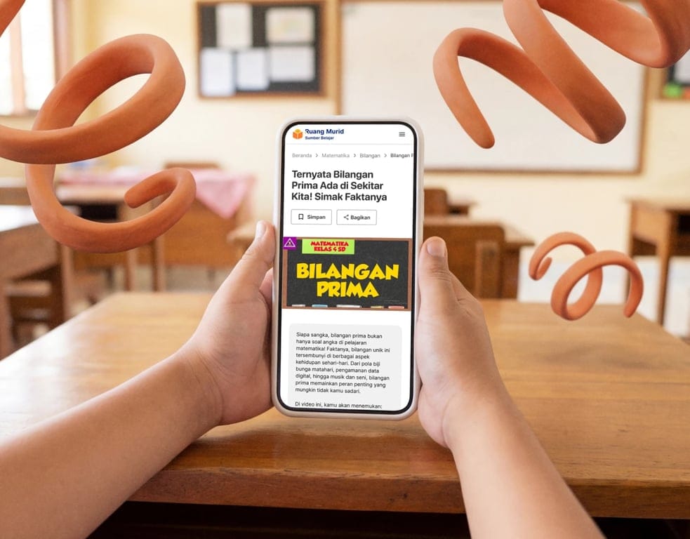 A student holding a smartphone in a classroom, showing a ‘Ruang Murid’ learning article titled ‘Bilangan Prima,’ with explanatory text and action buttons to save or share the lesson.
